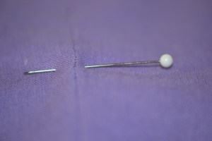 Mark the end of the zipper with a pin