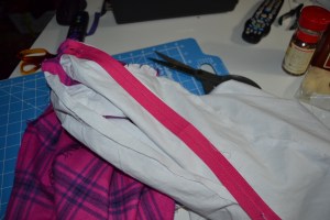 Press the tape and sew the zipper to the seam allowance only of the lining